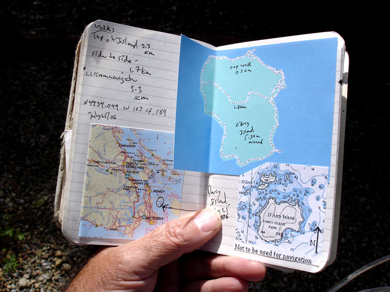 Notebook containing maps and information about D'Arcy Island
